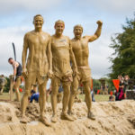 Three muddy men