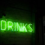 Neon green drinks sign