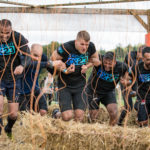 four men mud obstacle