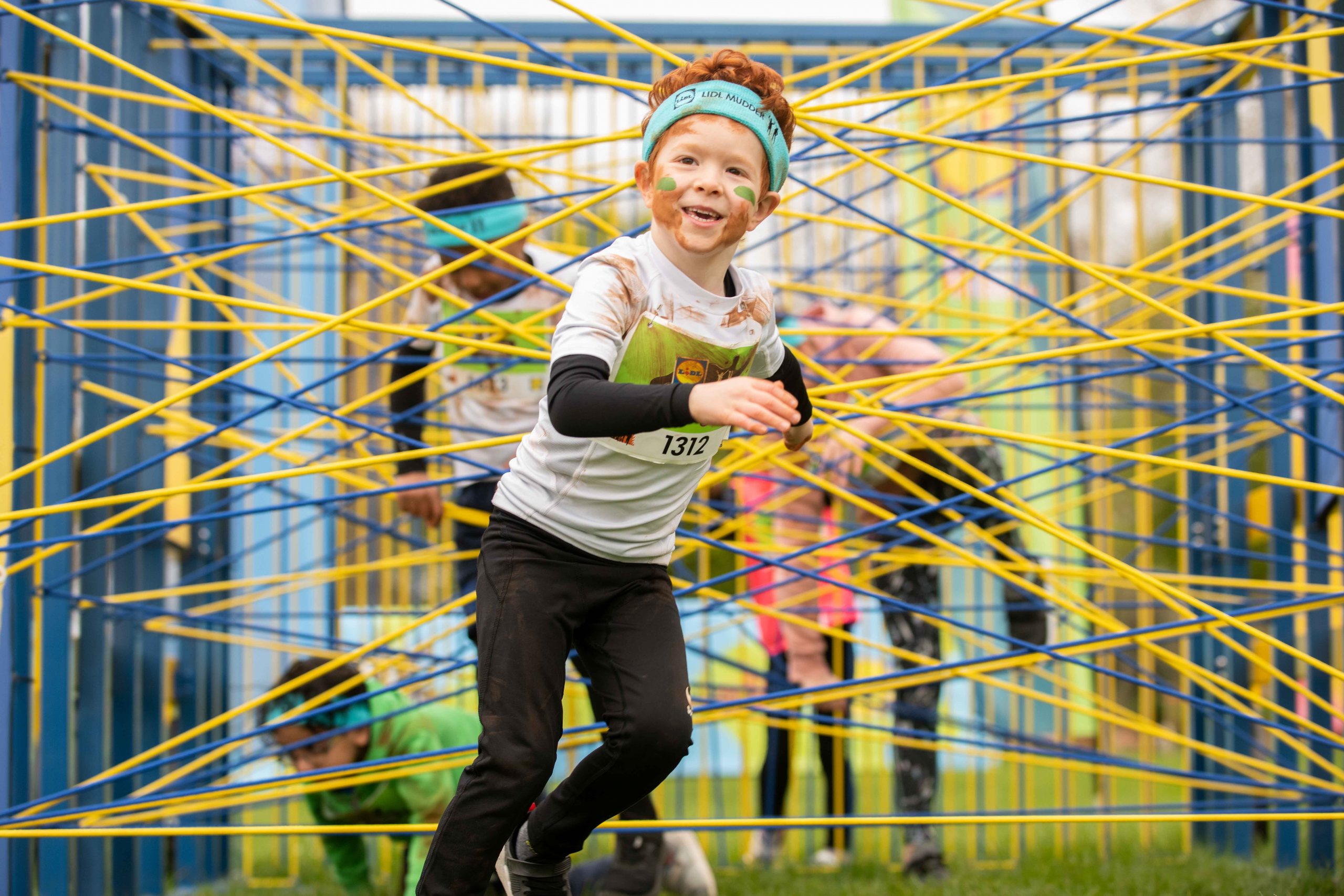 Kid Participant smiling as he finished one of the obstacles