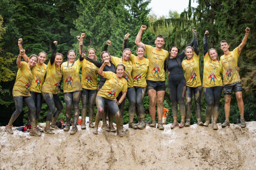 group of colleagues in mud