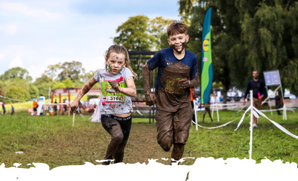 Two kid participants racing in the field