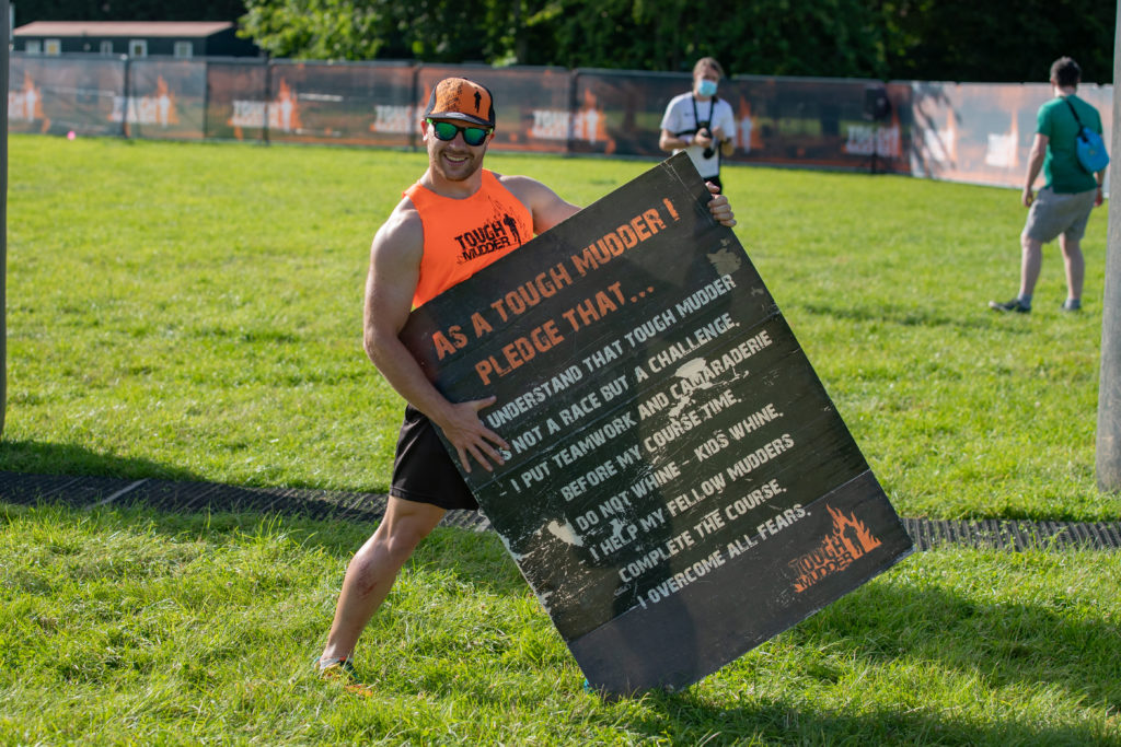 man with pledge sign