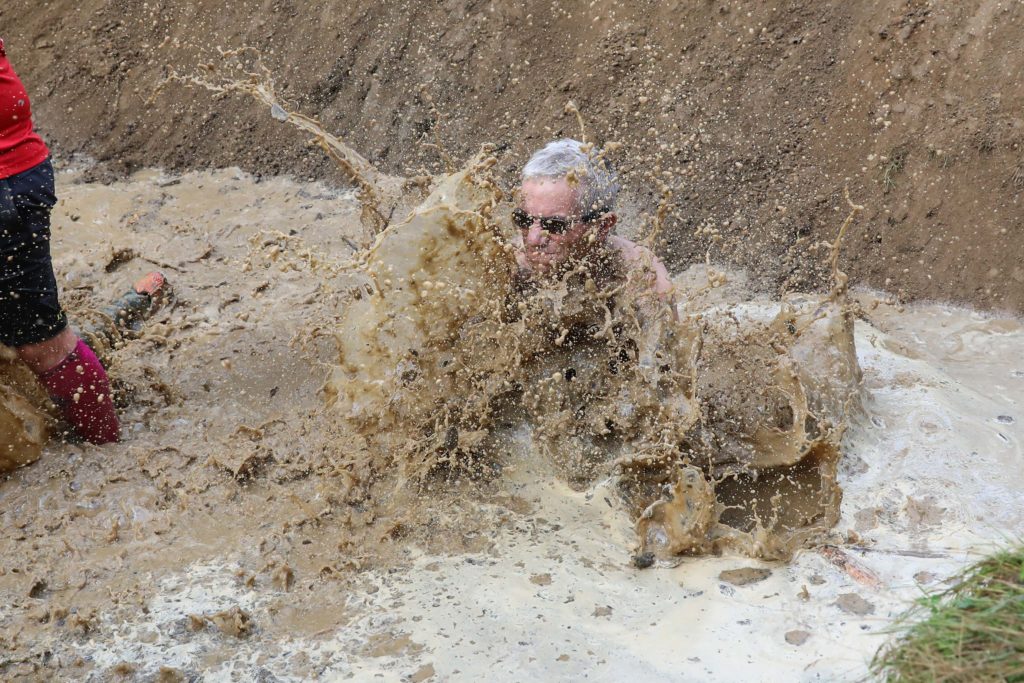 man in water mud pit 