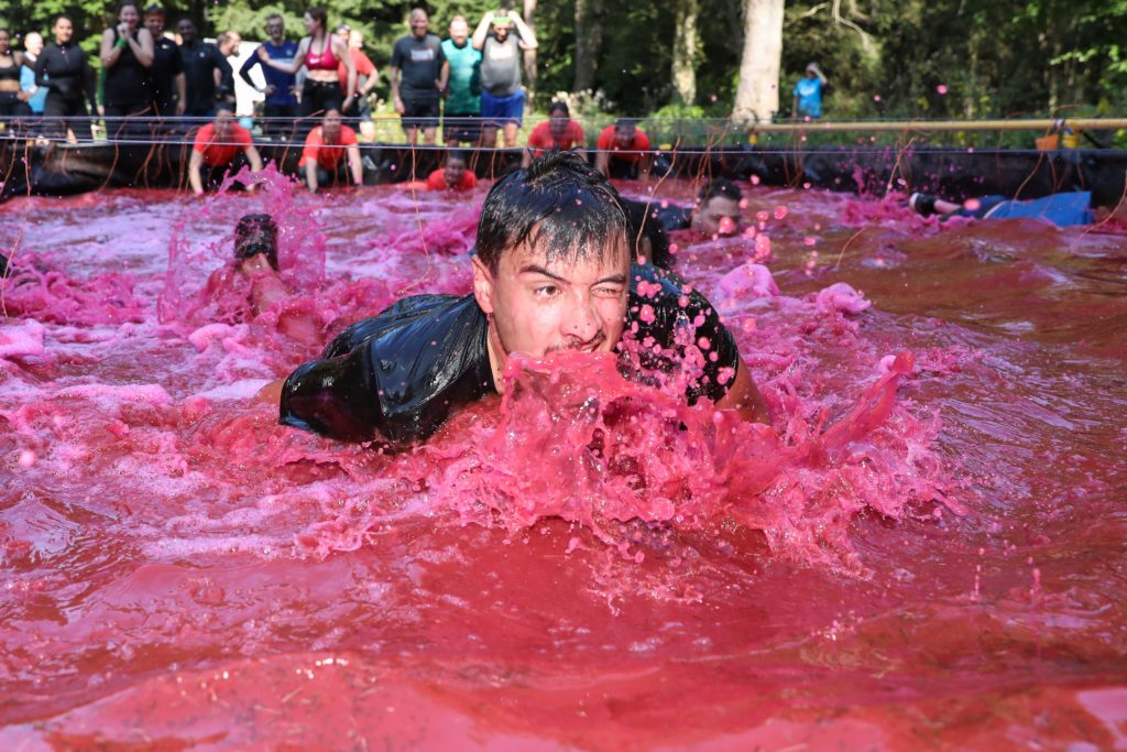 boy in pink water obstacle