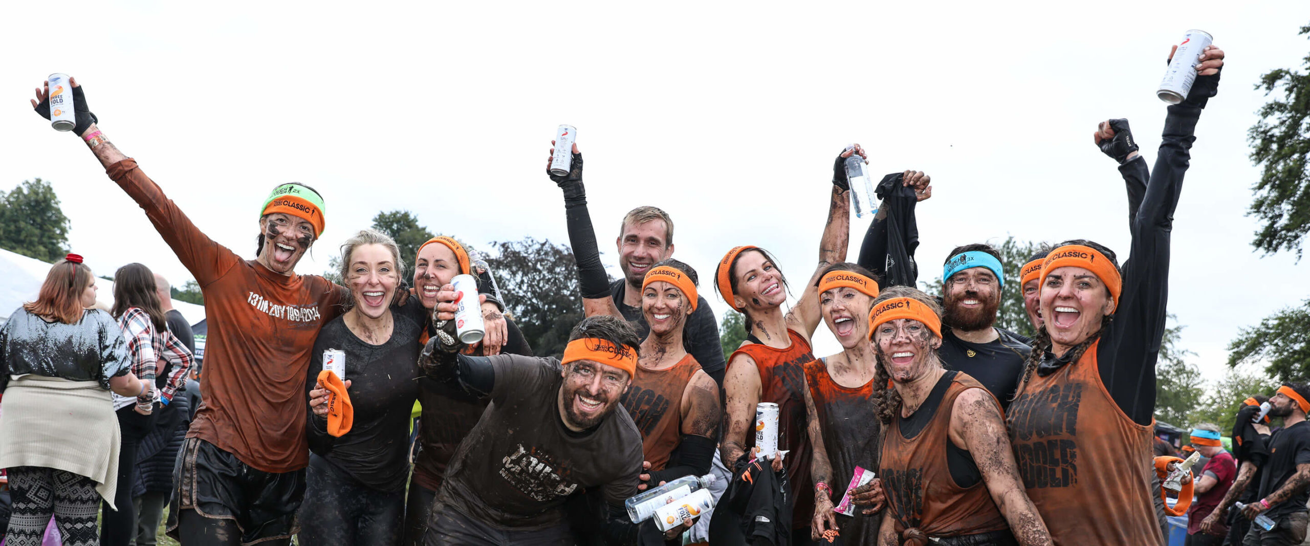 Participants smiling with their hands up in the air