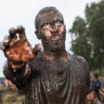 man covered mud
